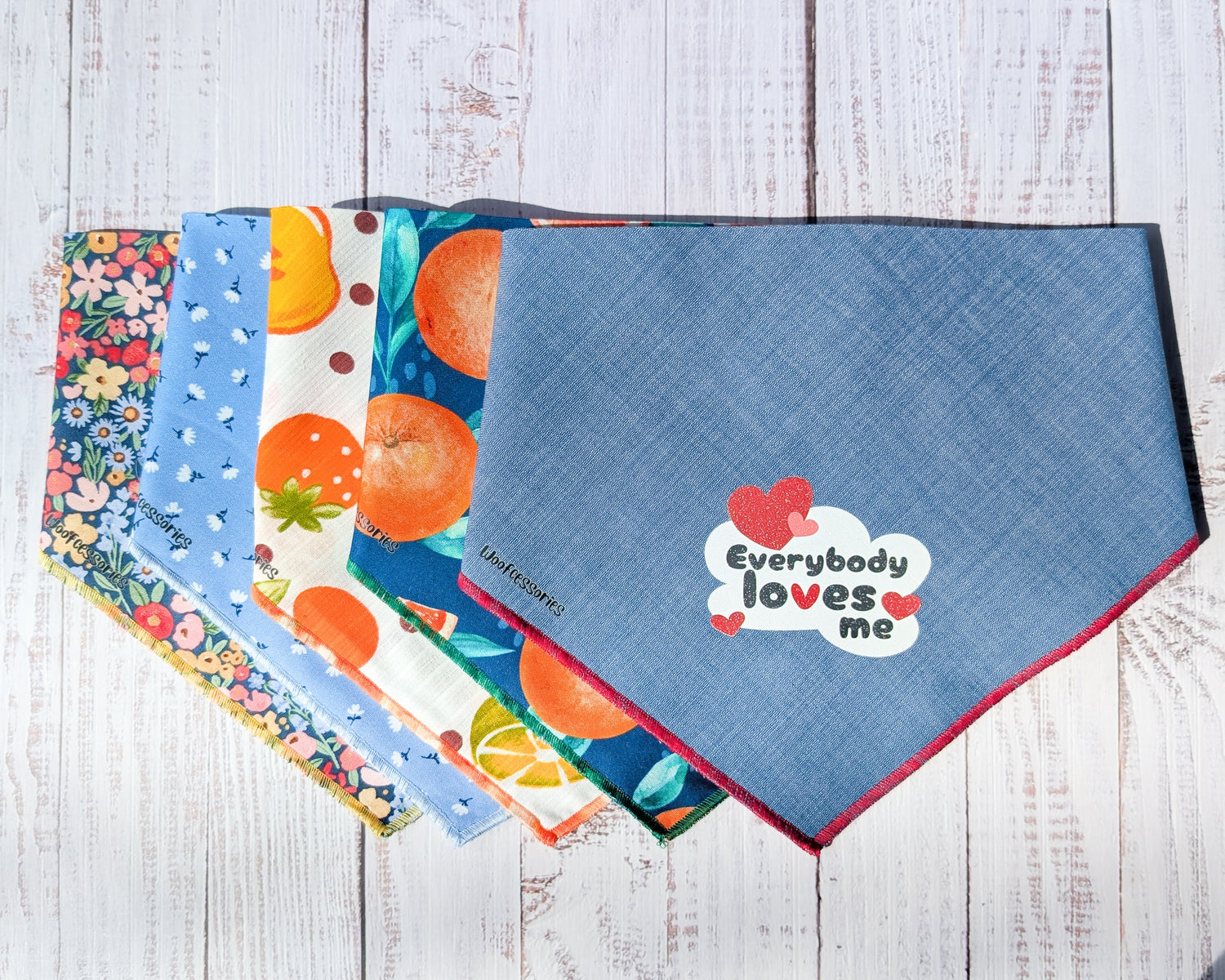 Five colorful bandanas on a white wooden background