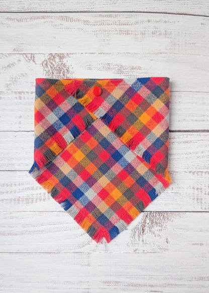 Colorful Flannel bandana with yellow, red, blue, pale blue colors on a wooden background