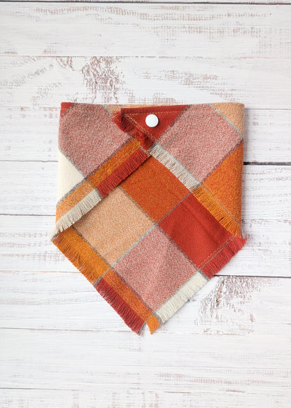 Orange white and yellow bandana on a wooden background 