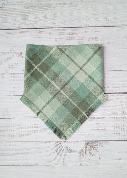 Muted Sage Green plaid flannel bandana on a white wooden surface