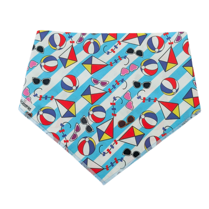 Colorful bandana with beach-themed pattern on a white and blue striped background