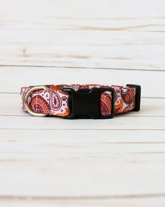 Dog collar with paisley pattern on a wooden surface