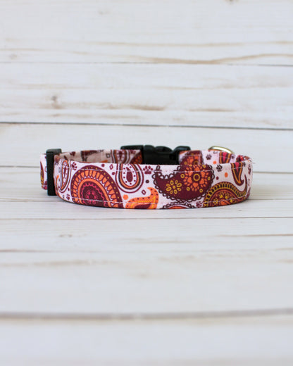 paisley Patterned dog collar on a wooden surface