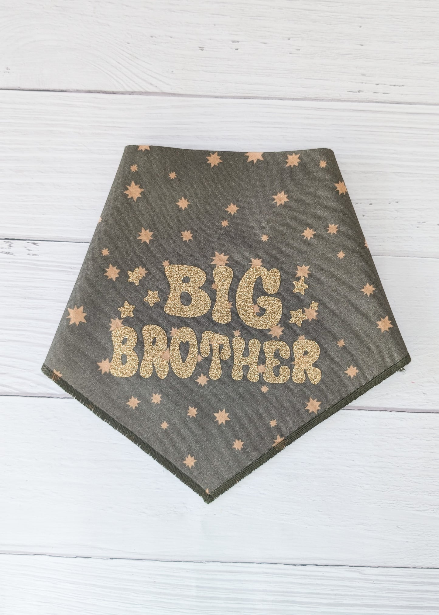Dark Olive bandana with 'BIG BROTHER' text and star patterns on a wooden surface
