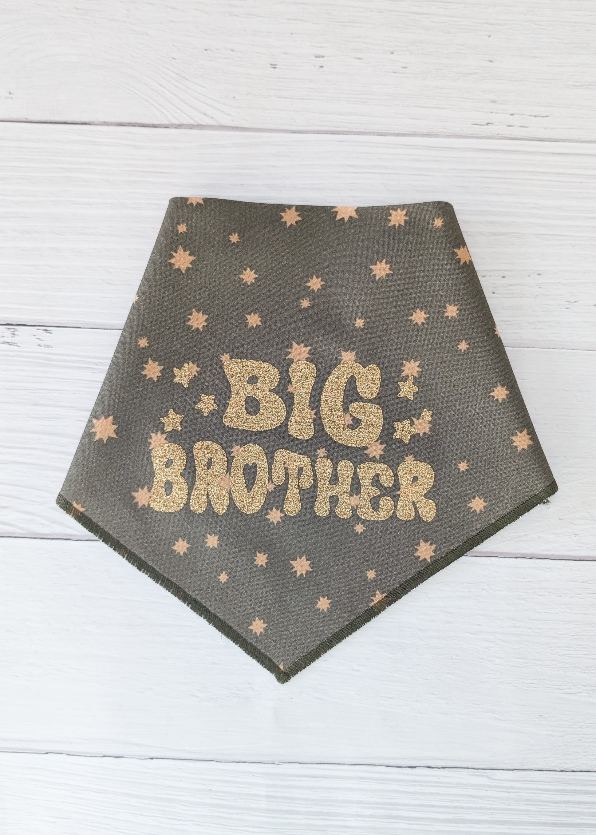 Dark Olive bandana with 'BIG BROTHER' text and star patterns on a wooden surface