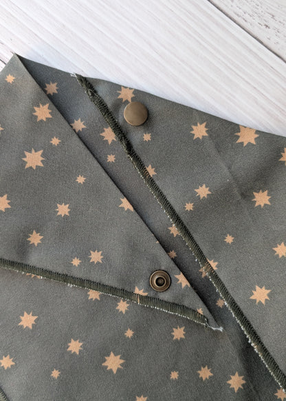 Dark Olive Bandana close up with star patterns and snaps on a white background