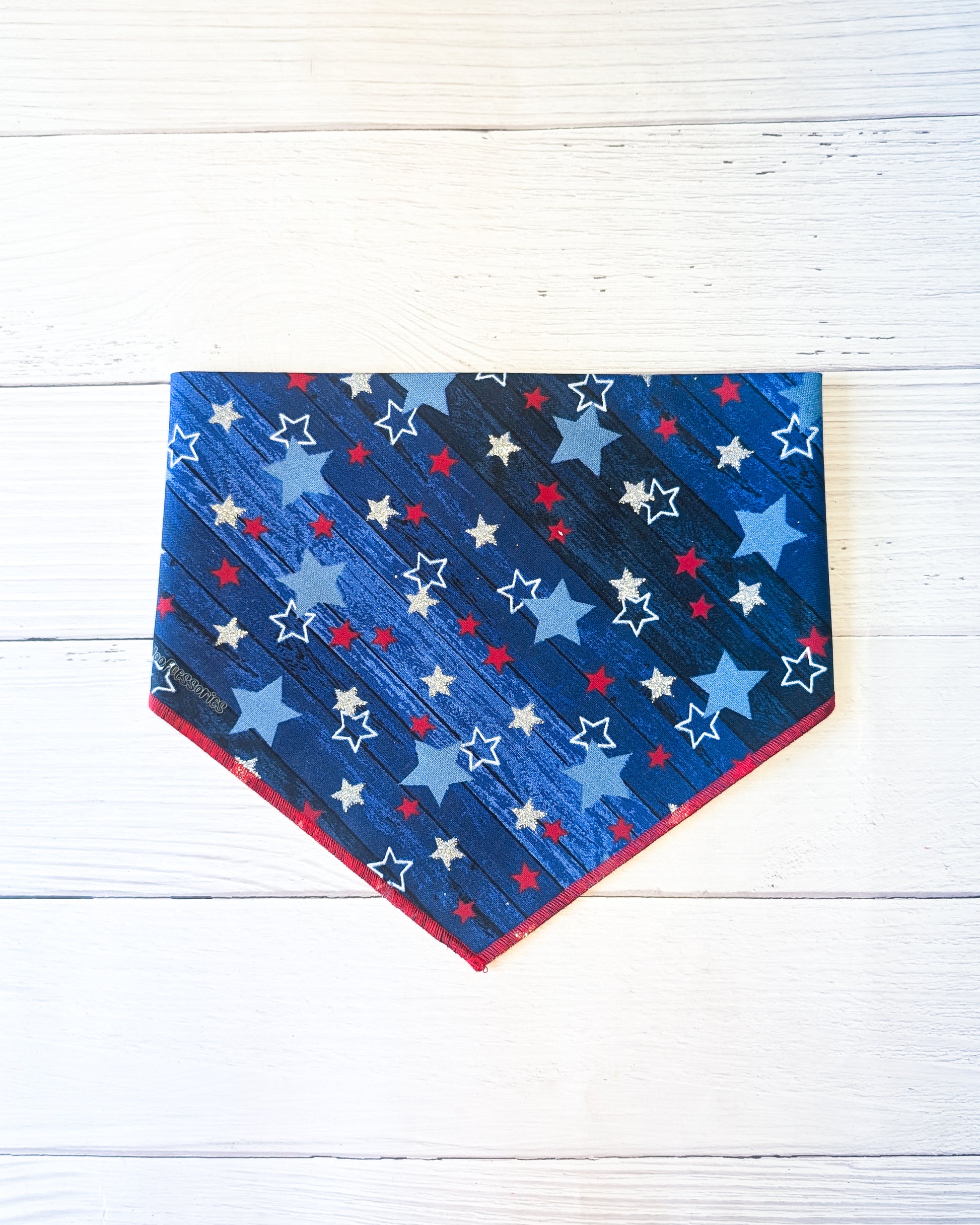 Blue bandana with star pattern on a white wooden surface