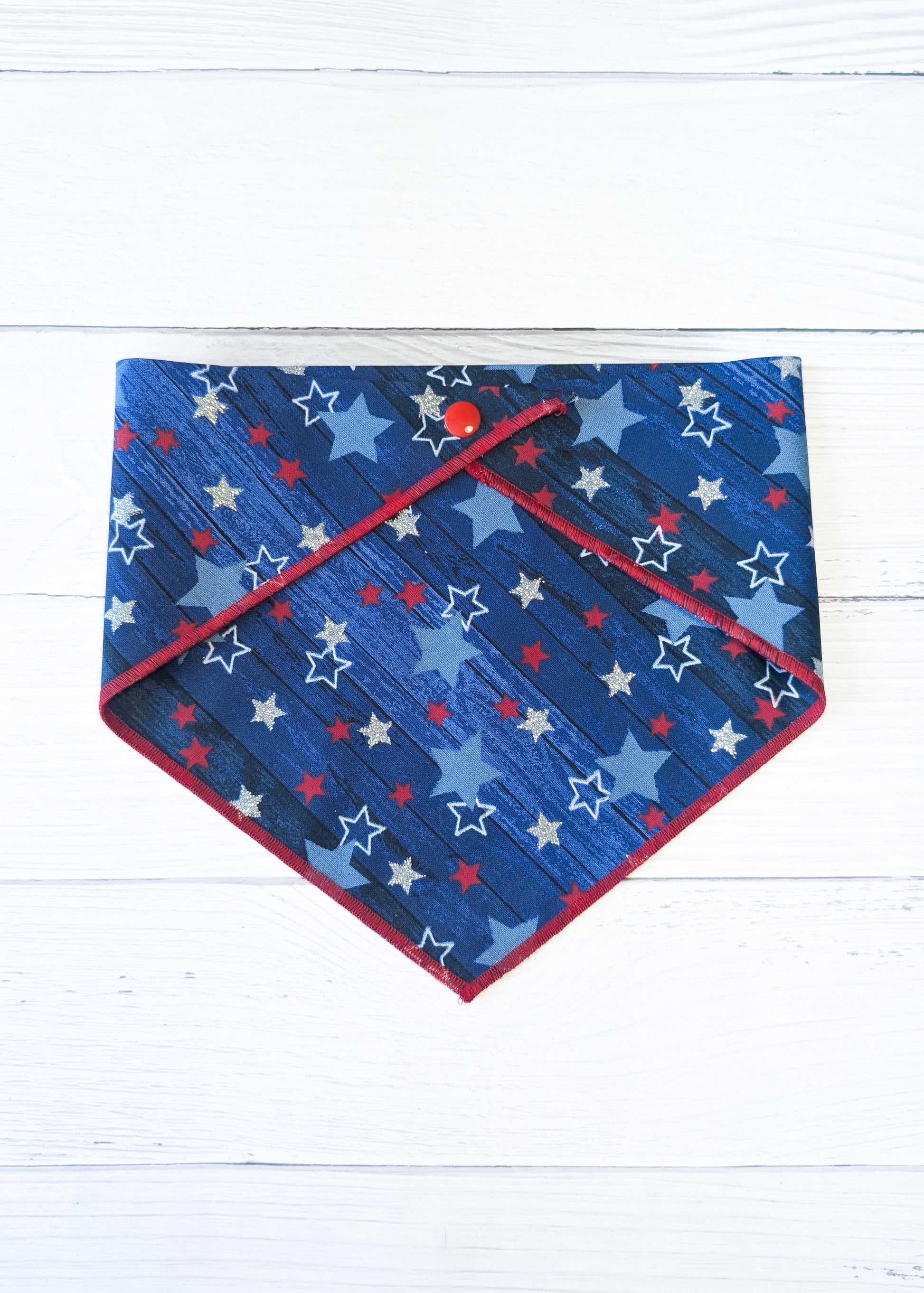 Blue bandana with star pattern on a white wooden surface