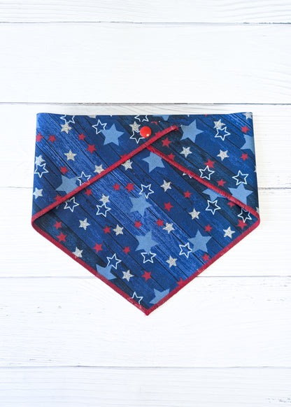 Blue bandana with star pattern on a white wooden surface